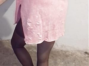 Turkish woman in pink dress leg nylon stockings